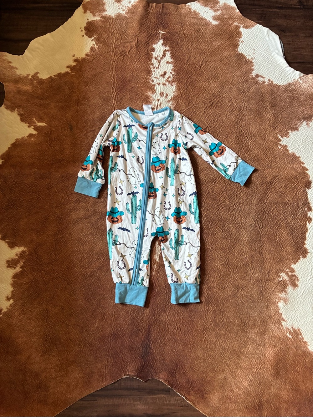 Amazon White Kids One-Piece Romper with Turquoise Trim and Orange Cactus Accents